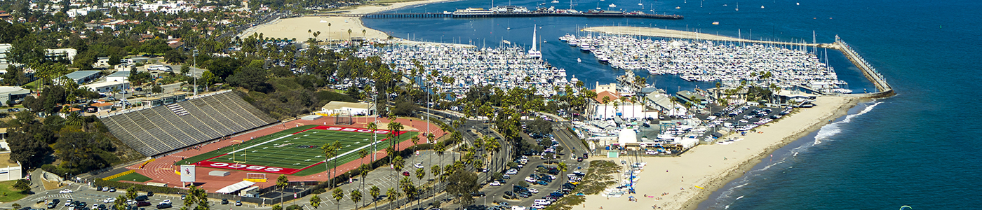 Campus panorama showing La Playa Stadium and coastline